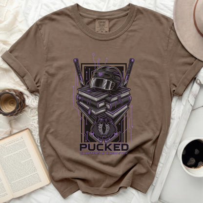 T-shirt with a graphic of hockey gear and books, reading "Pucked Chapters & Chemistry".