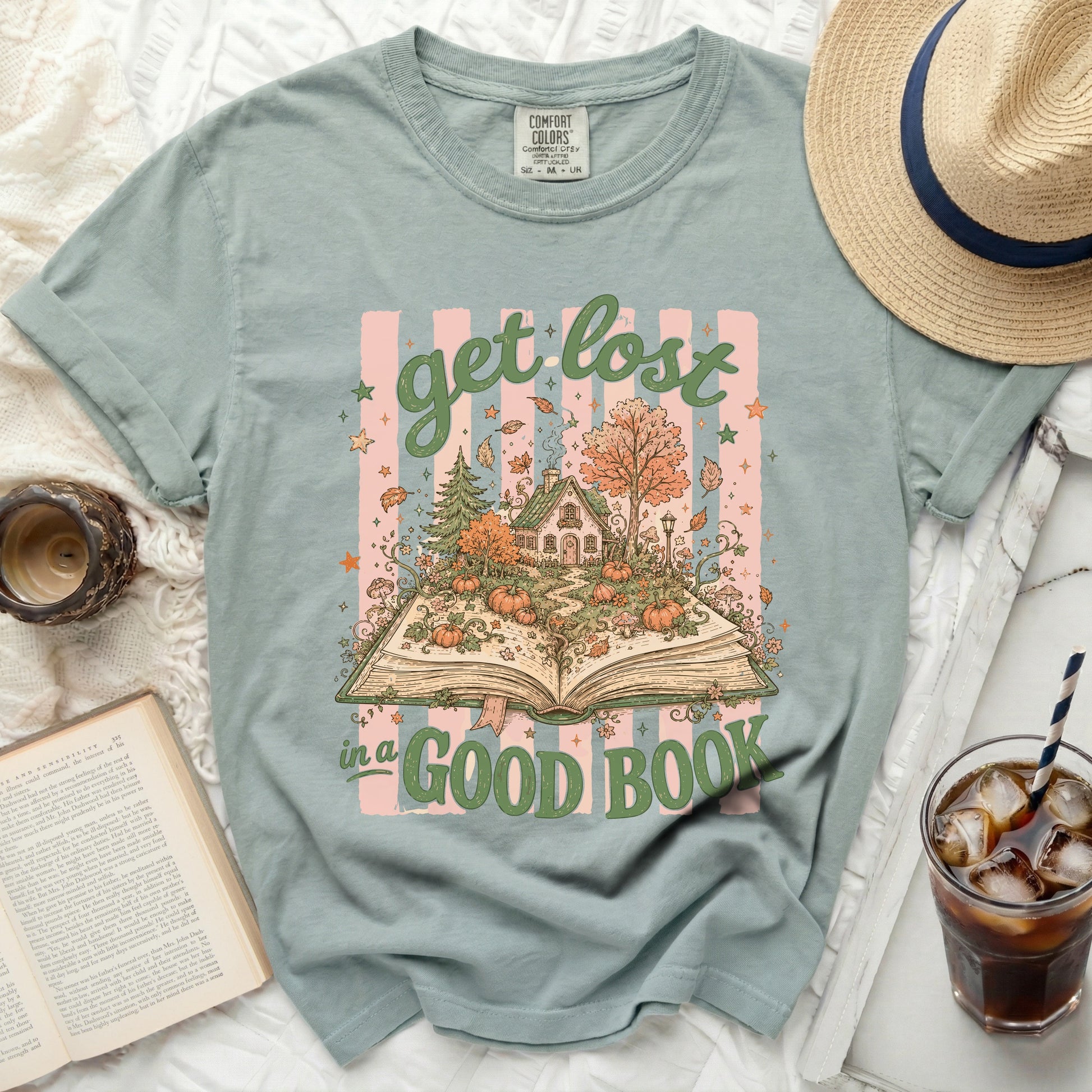 Sage t-shirt with "Get Lost in a Good Book" graphic featuring an open book.
