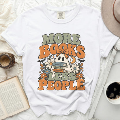 White t-shirt with retro ghost, books, and text: "More Books Less People."
