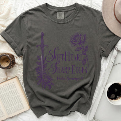 Dark grey t-shirt with purple graphic "Soft Heart Sharp Edges Violet Sorrengail".