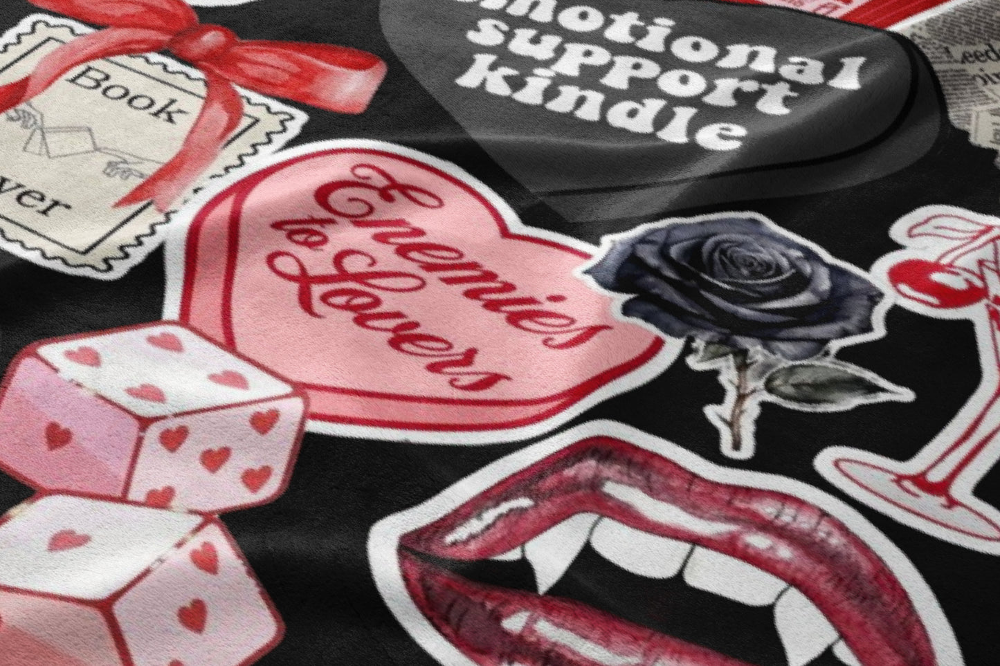 Collage of stickers including dice, lips, roses, and text on black background.