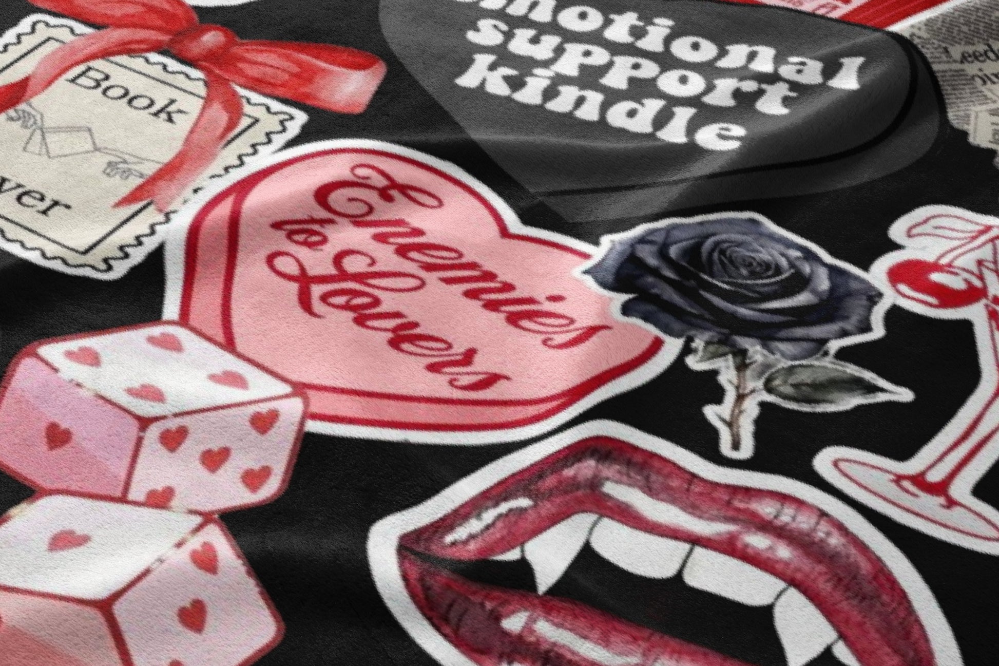 Collage of stickers including dice, lips, roses, and text on black background.