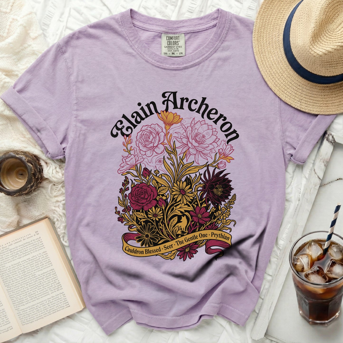 Purple t-shirt with "Elain Archeron" and floral design.