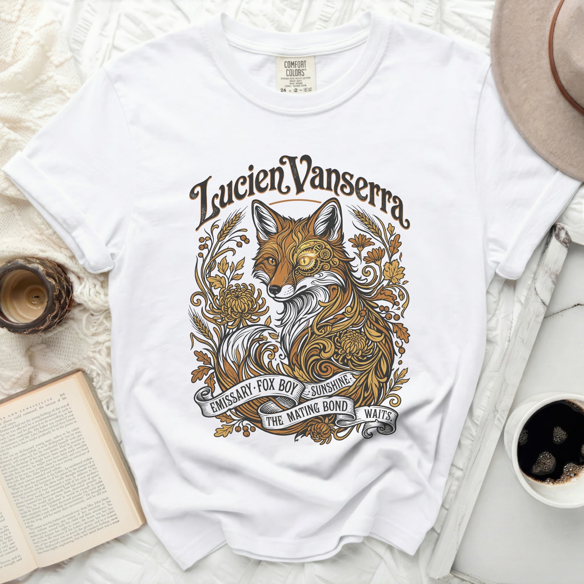 White t-shirt with a gold fox illustration and text "Lucien Vanserra" and "Emissary Fox Boy Sunshine The Mating Bond Waits".
