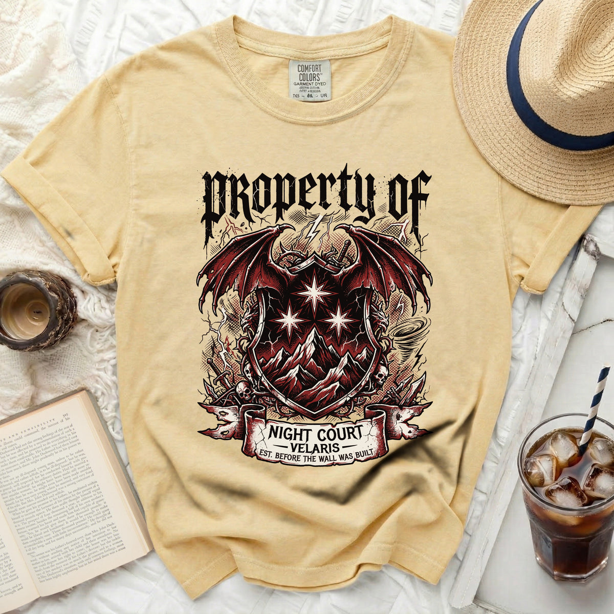 Yellow t-shirt with "Property of Night Court Velaris" graphic.