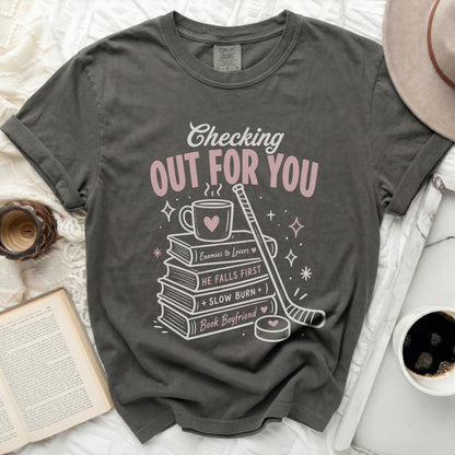 T-shirt with "Checking Out For You" and book-themed graphics.
