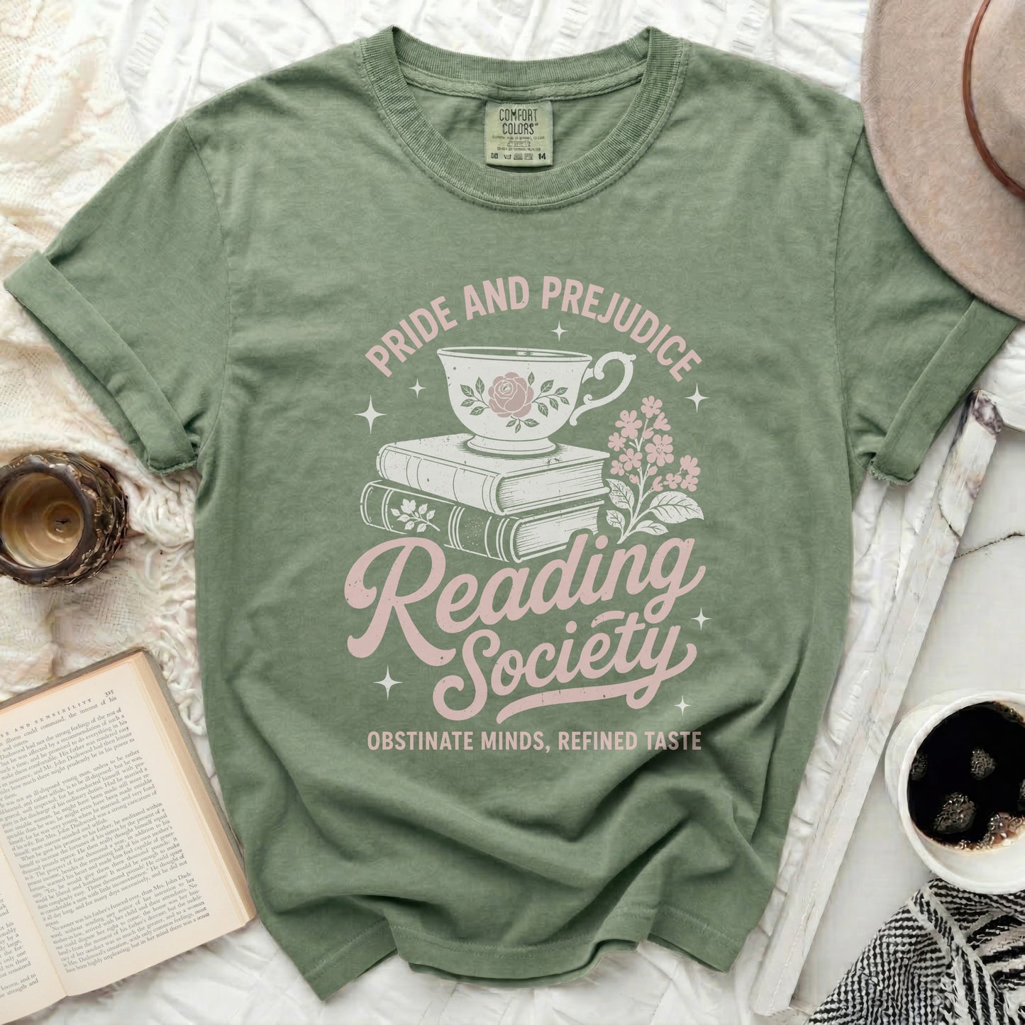 Dusty green t-shirt with "Pride and Prejudice Reading Society" graphic.