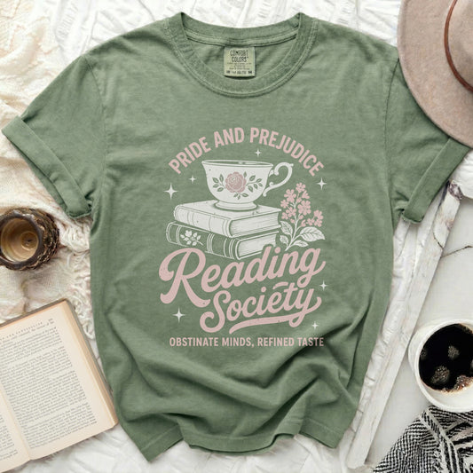 Dusty green t-shirt with "Pride and Prejudice Reading Society" graphic.