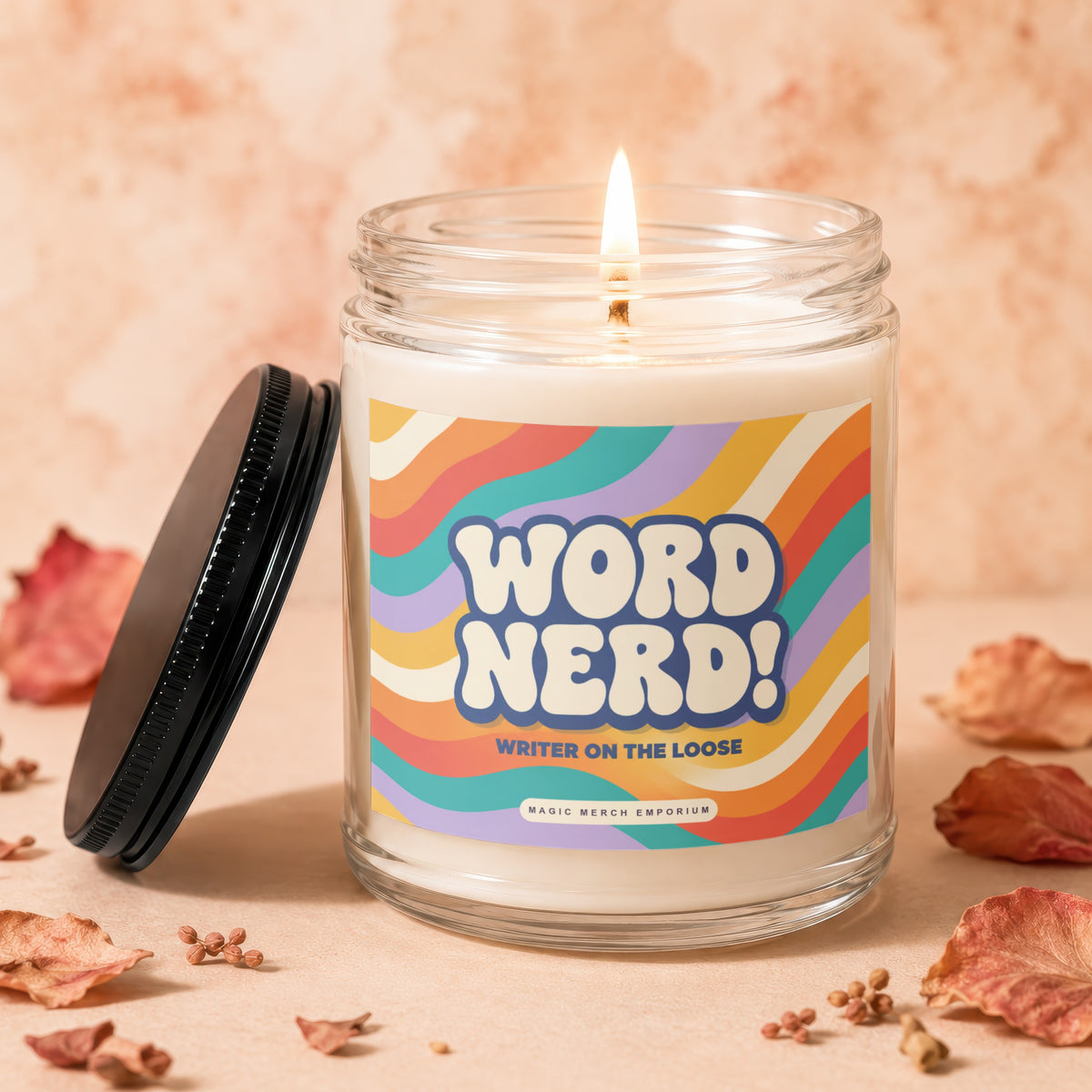 Candle with "WORD NERD! WRITER ON THE LOOSE" text and colorful wavy design.