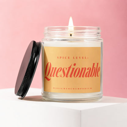 Candle with "Spice Level: Questionable" and "MagicMerchEmporium" text on label.
