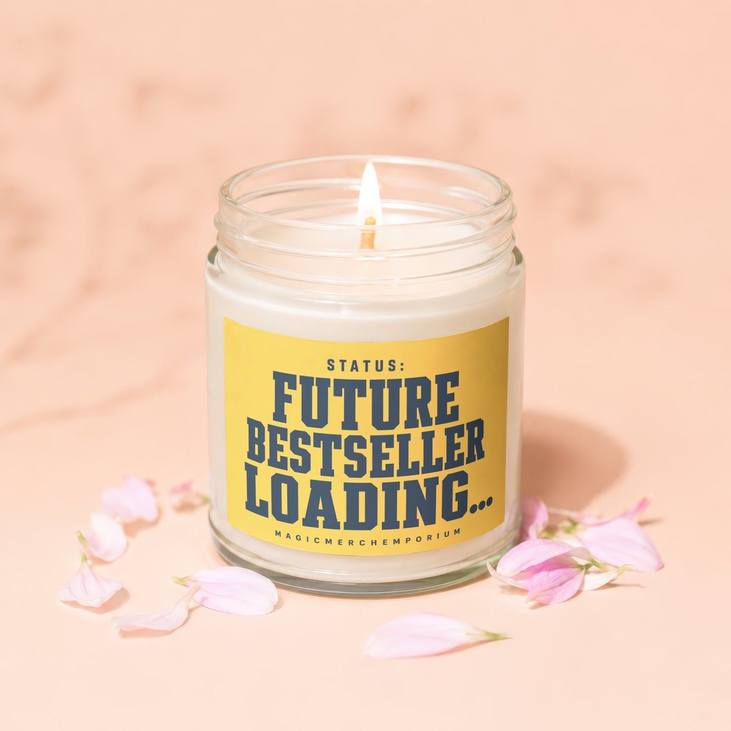 Candle with yellow label reading "STATUS: FUTURE BESTSELLER LOADING..."