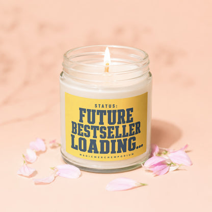 Candle with yellow label reading "STATUS: FUTURE BESTSELLER LOADING..."