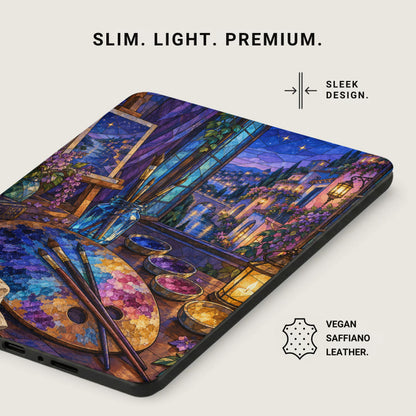 A device case with a stained-glass style painting of an artist's palette and a moonlit European town.