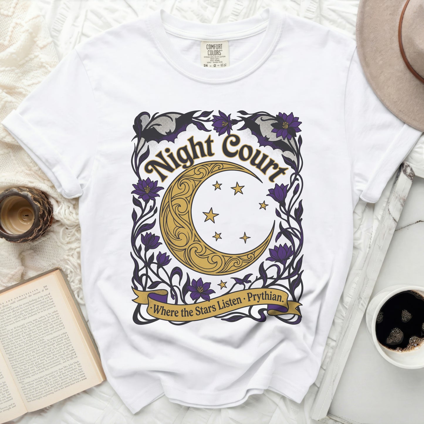 White t-shirt with "Night Court" text, crescent moon, stars, and flowers.