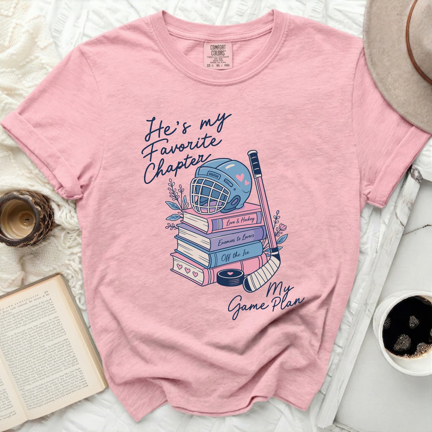 Pink t-shirt with "He's my Favorite Chapter" and hockey theme.