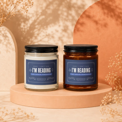 Two scented candles, one clear, one amber, with "I'm Reading" labels.