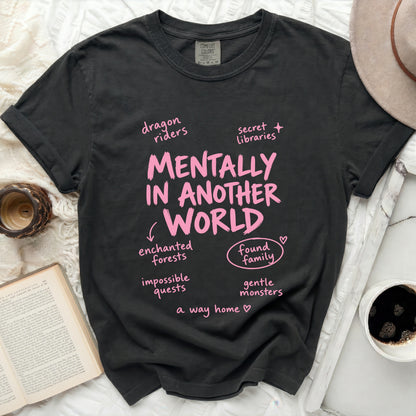 Charcoal Comfort Colors shirt with pink text "Mentally In Another World" and related phrases.