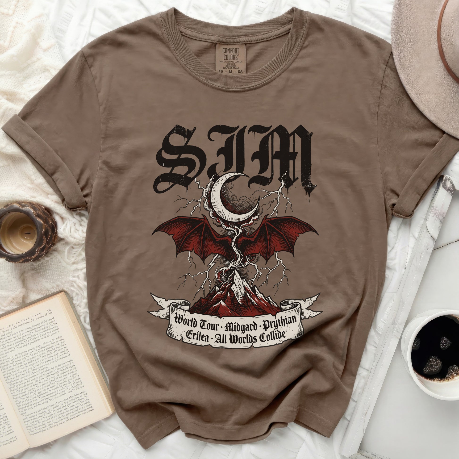 Brown Comfort Colors t-shirt with "SIM" logo and world tour text.