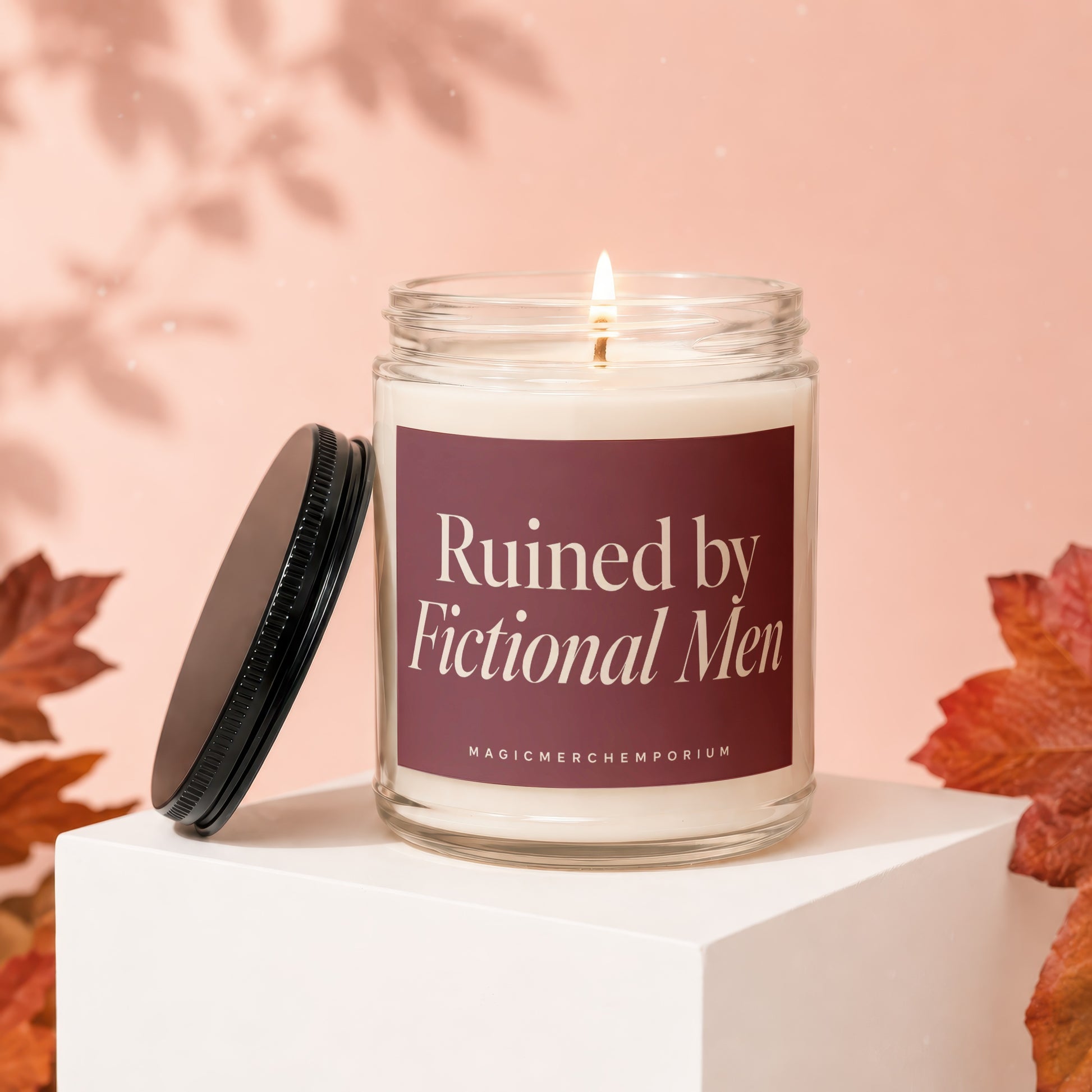 Candle with text "Ruined by Fictional Men" on a plum label.