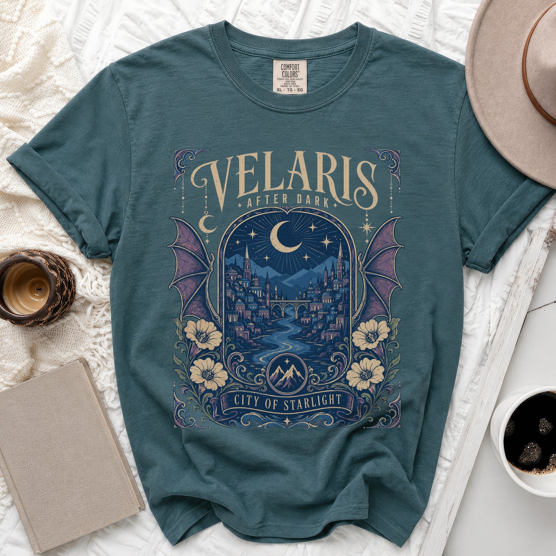 Teal t-shirt with "Velaris After Dark City of Starlight" graphic and city scene.