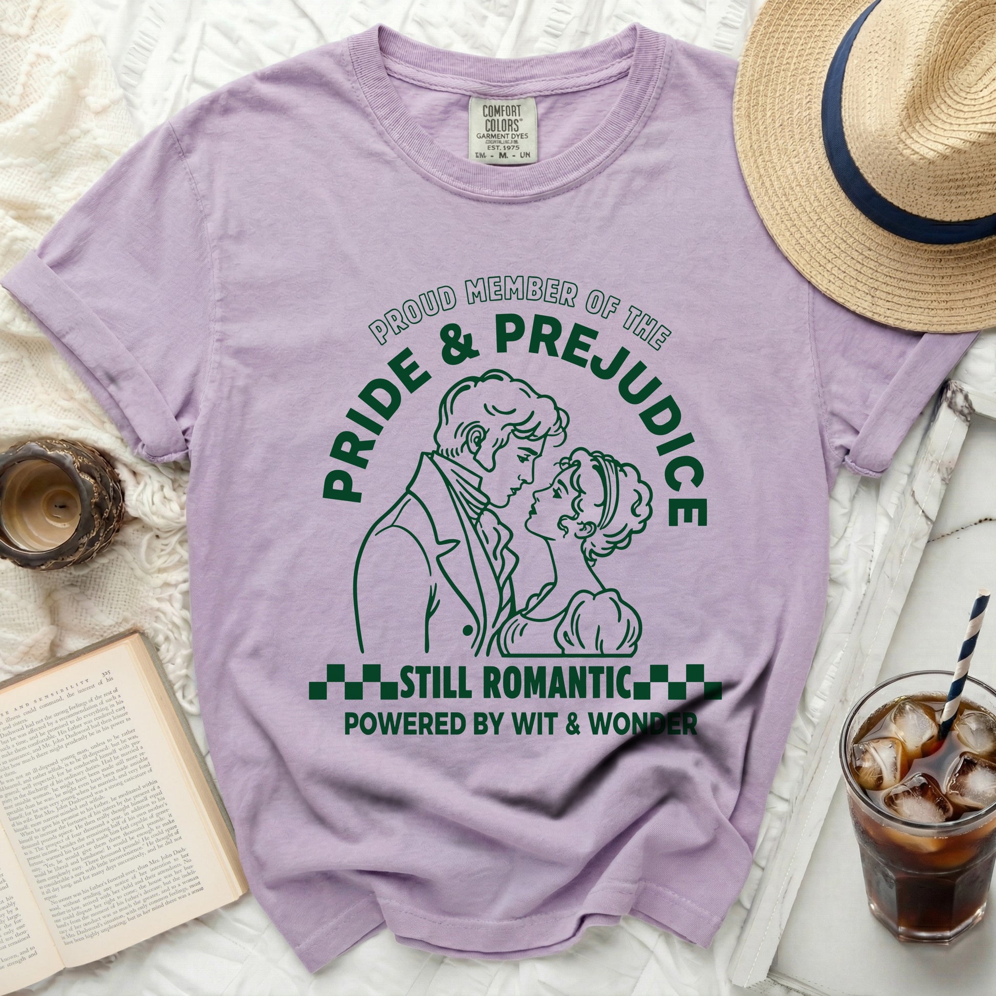 Purple t-shirt with green Pride and Prejudice graphic and text