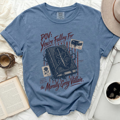 Blue t-shirt with "POV: You're Falling For the Morally Grey Villain." text.