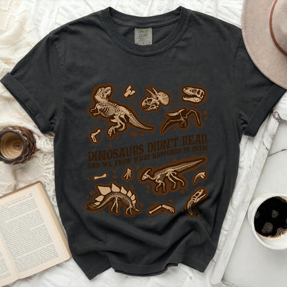 Black t-shirt with dinosaur skeleton graphic and text.