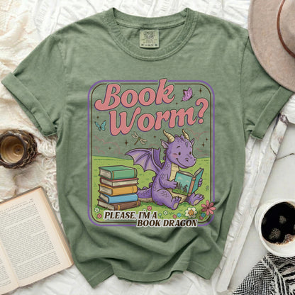 Green t-shirt with a cartoon dragon reading books, "Book Worm?" and "PLEASE, I'M A BOOK DRAGON" text.