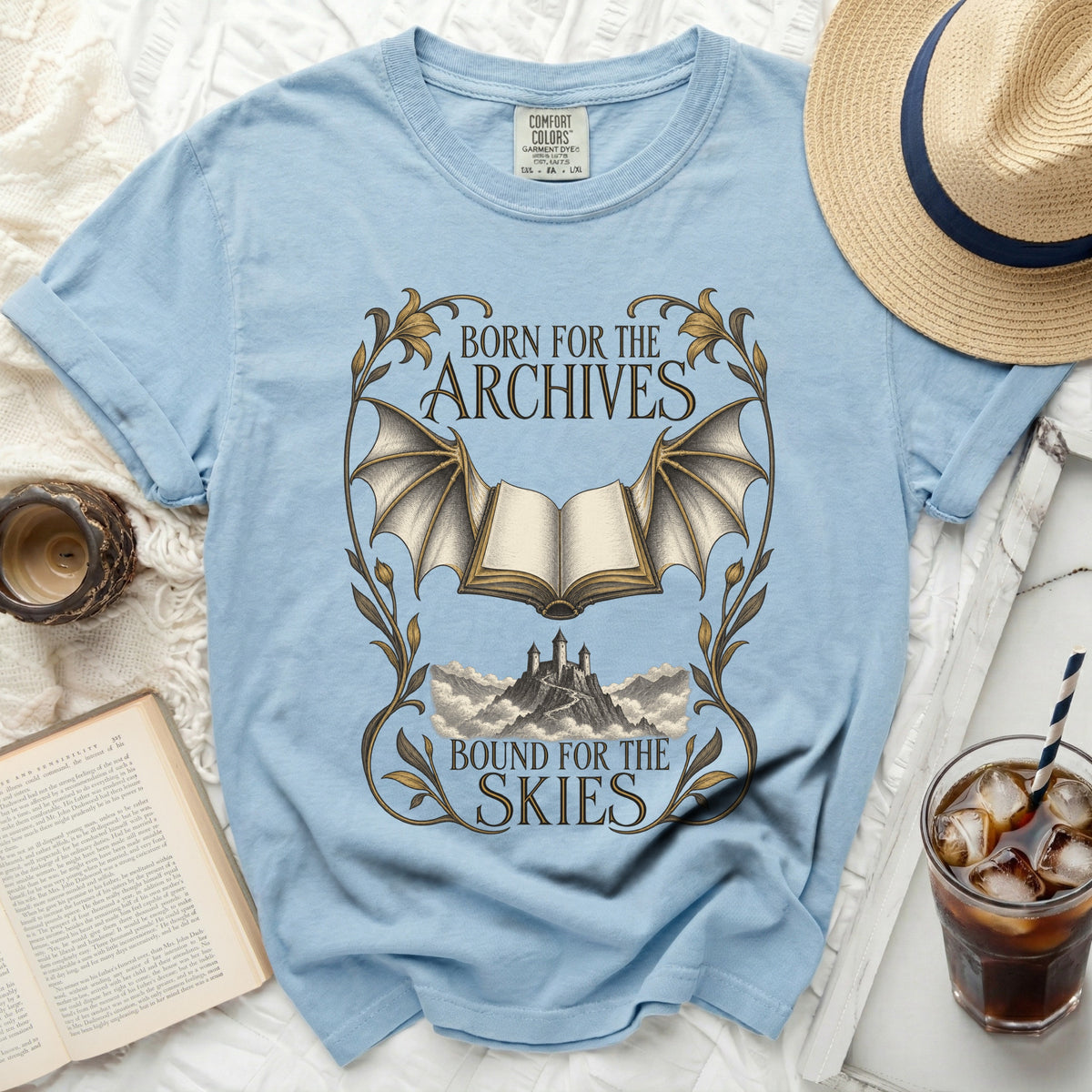 Light blue t-shirt with "Born for the Archives, Bound for the Skies" graphic.