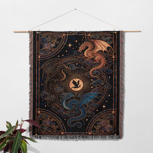 a large tapestry hanging on a wall, depicting a dragon and a sun.