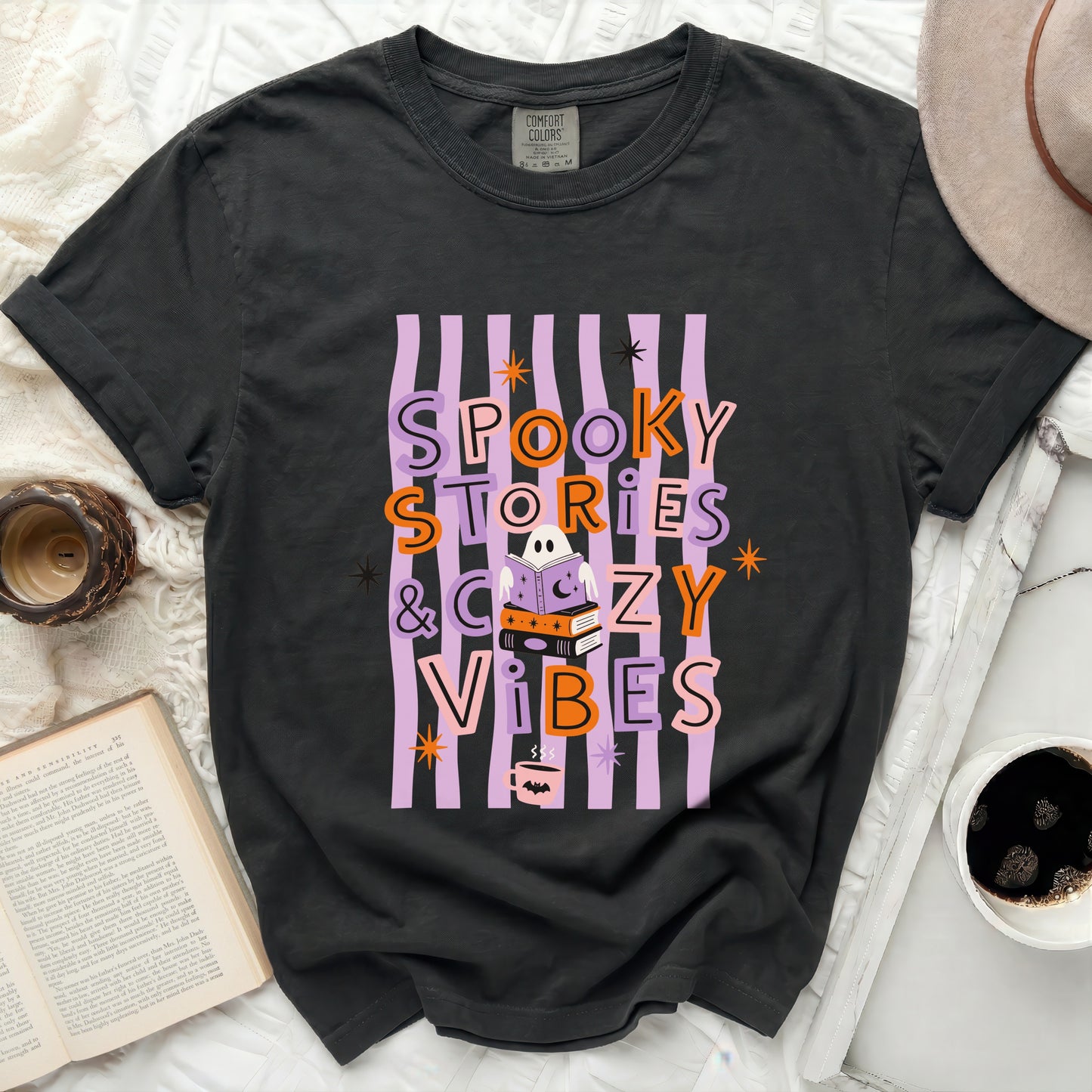 Gray t-shirt with "Spooky Stories & Cozy Vibes" Halloween graphic.