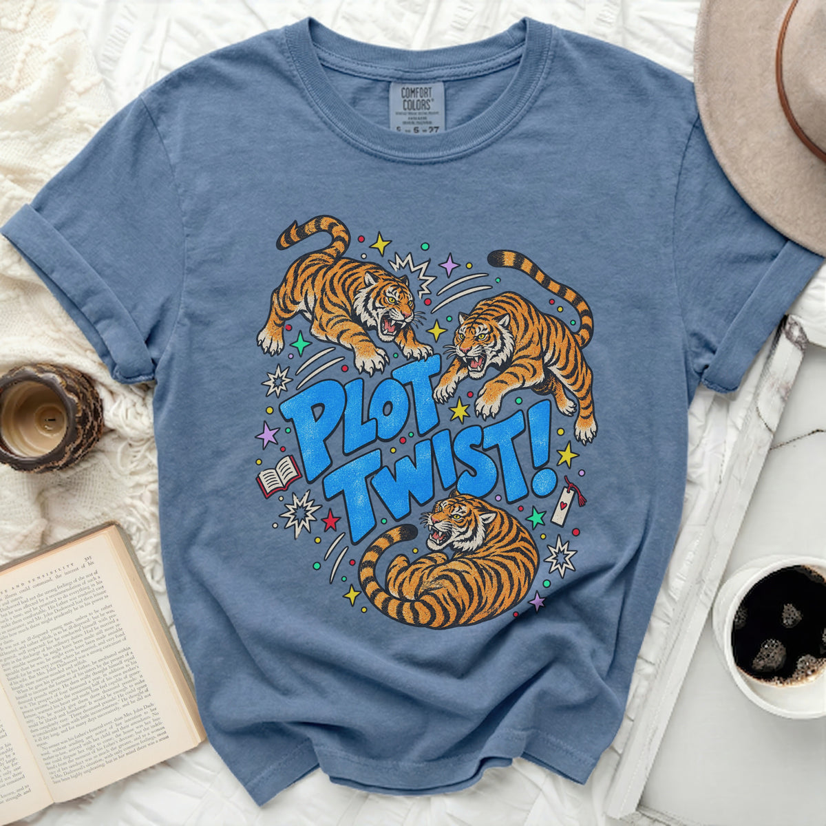 Three tigers bursting out of the words "PLOT TWIST!" on a blue t-shirt.