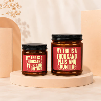 Two candles with red labels reading "My TBR is a thousand plus and counting".