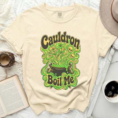 Cream Comfort Colors t-shirt with retro "Cauldron Boil Me" graphic featuring skulls and flowers.