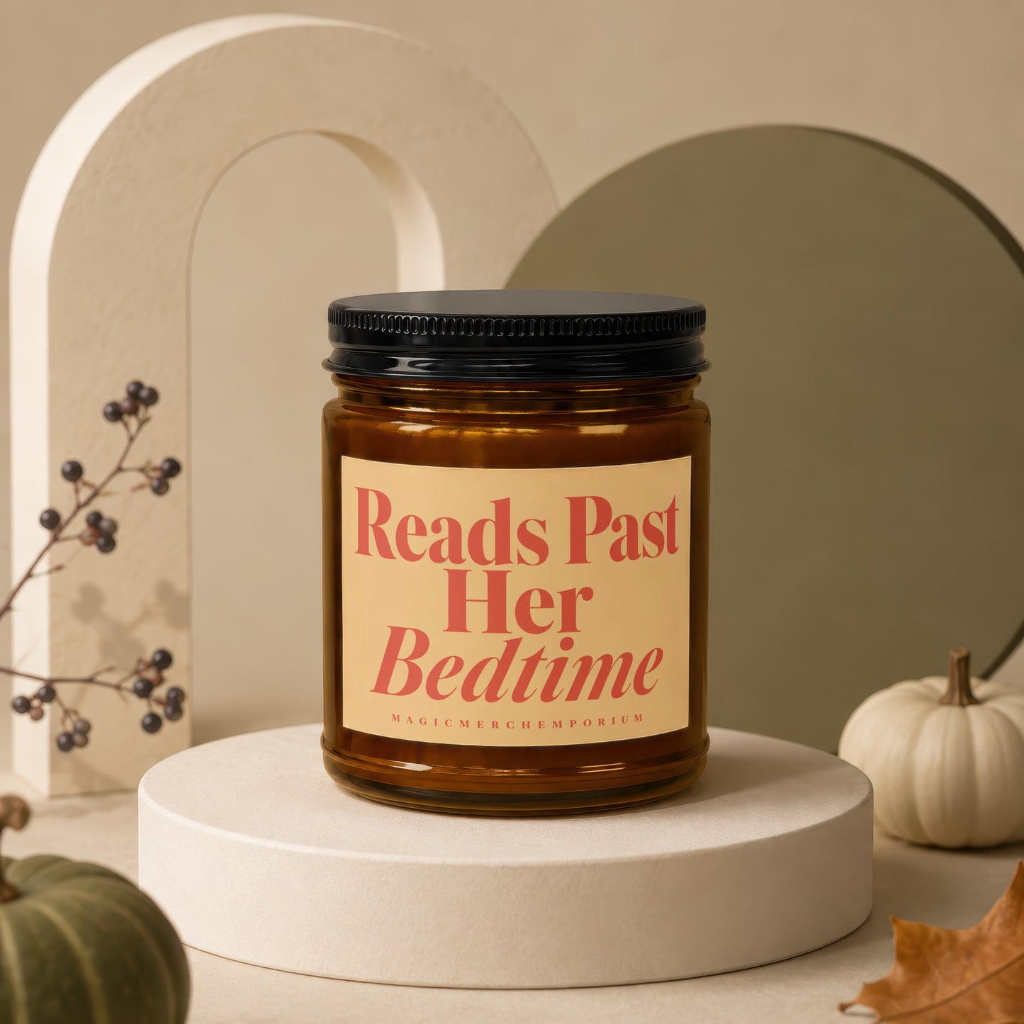 Amber candle with black lid, reads "Reads Past Her Bedtime" and "MagicMerchEmporium".
