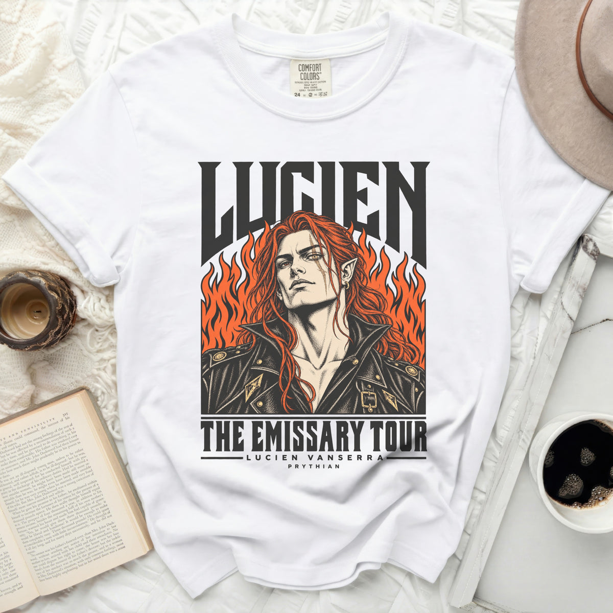 White t-shirt with "LUCIEN THE EMISSARY TOUR" graphic.