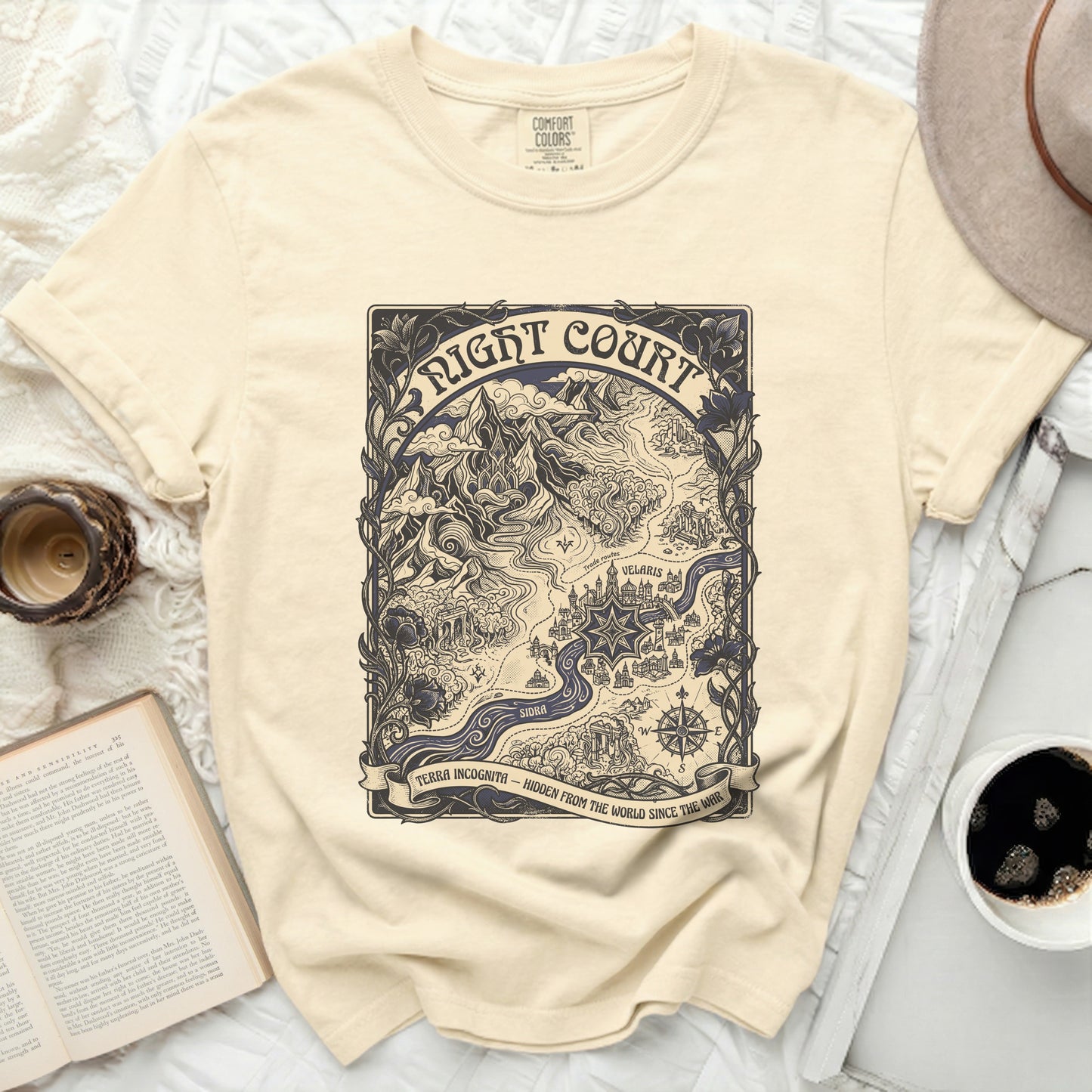 Cream t-shirt with "Night Court" map graphic and "Terra Incognita" banner text.
