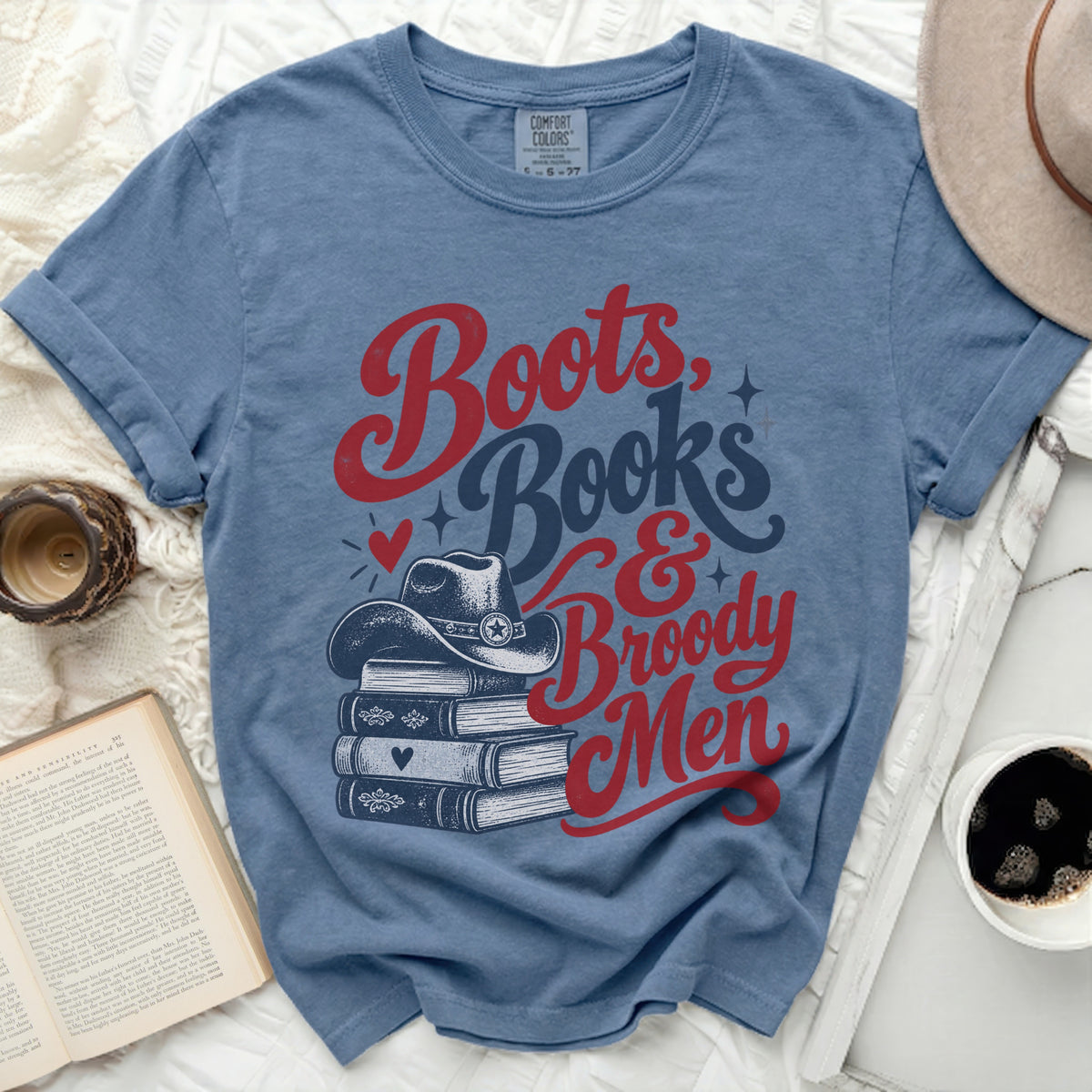 Blue Comfort Colors t-shirt with "Boots, Books & Broody Men" text and cowboy hat.