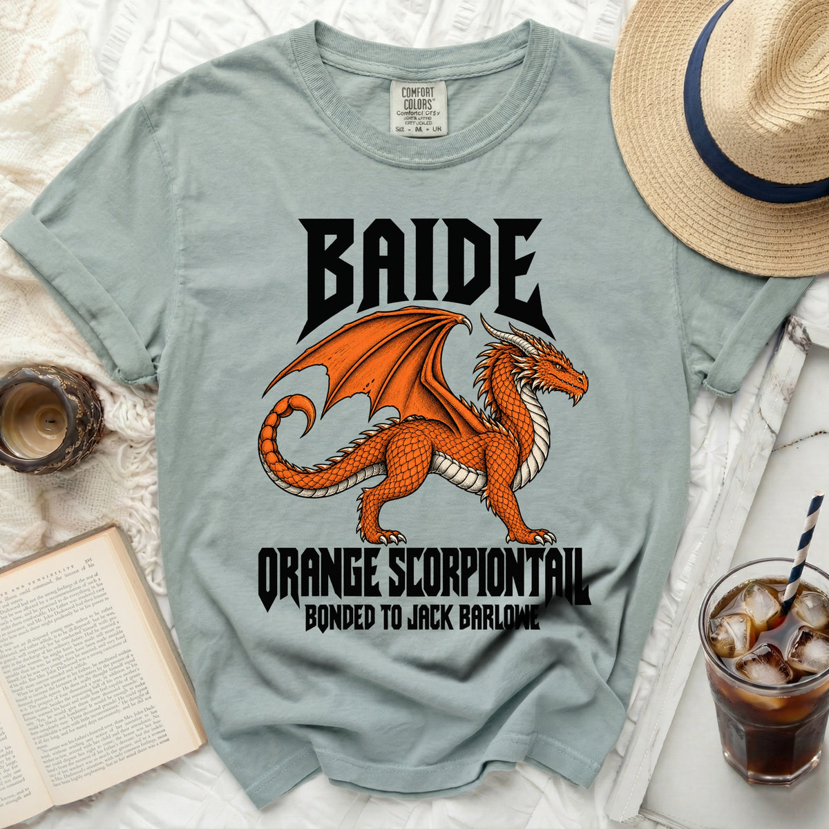 Light blue t-shirt with black text "BAIDE" and an orange dragon graphic.