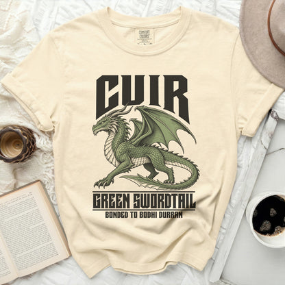 Cream t-shirt with a green dragon graphic and text "CUIR", "GREEN SWORDTAIL", "BONDED TO BODHI DURRAN".