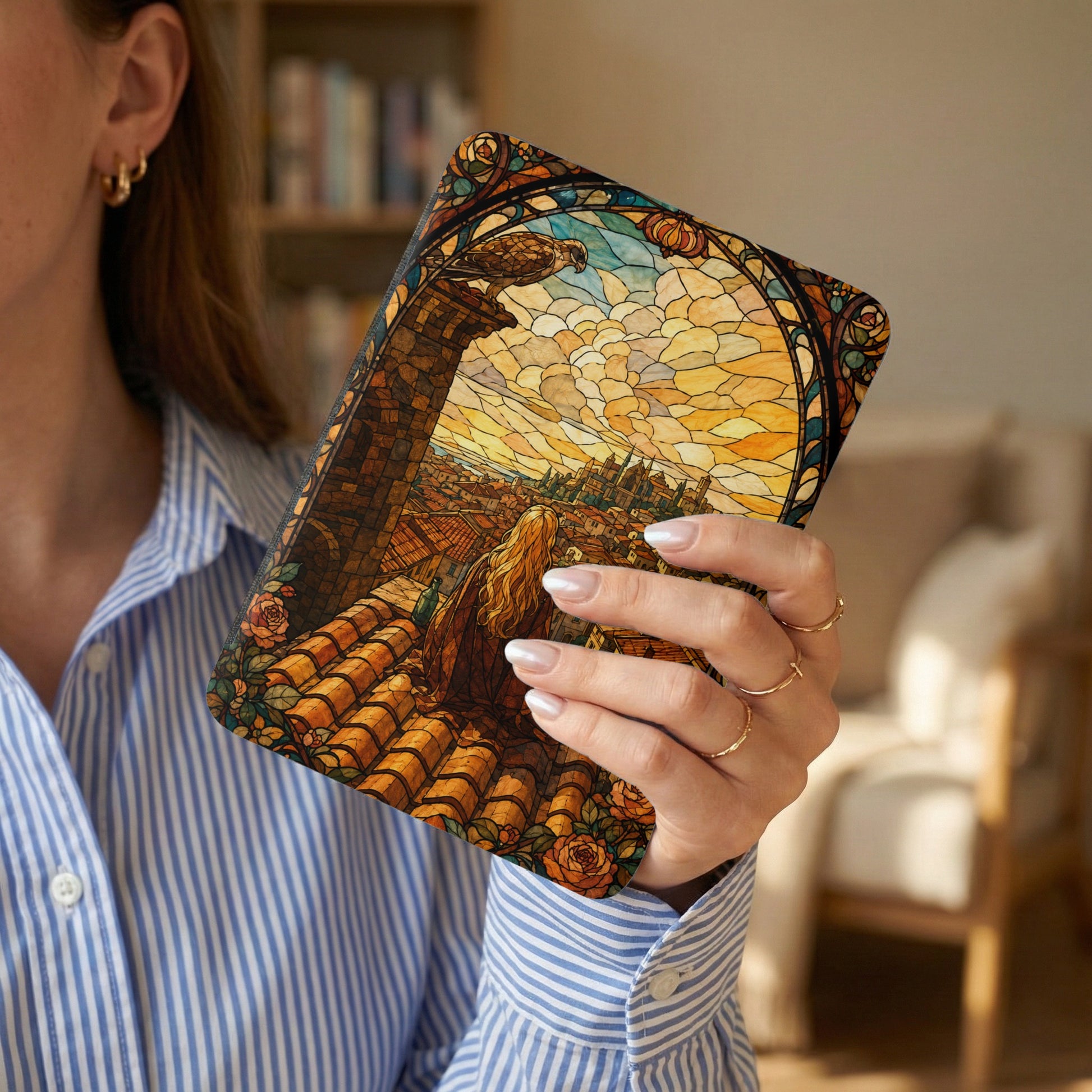 Stained glass pattern tablet cover with a bird overlooking a city skyline.