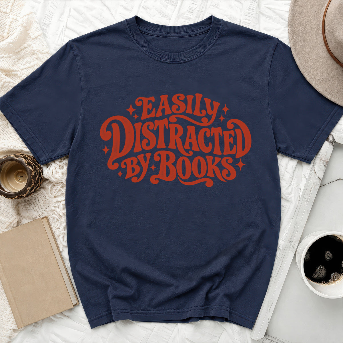 Navy t-shirt with red text saying "Easily Distracted by Books".