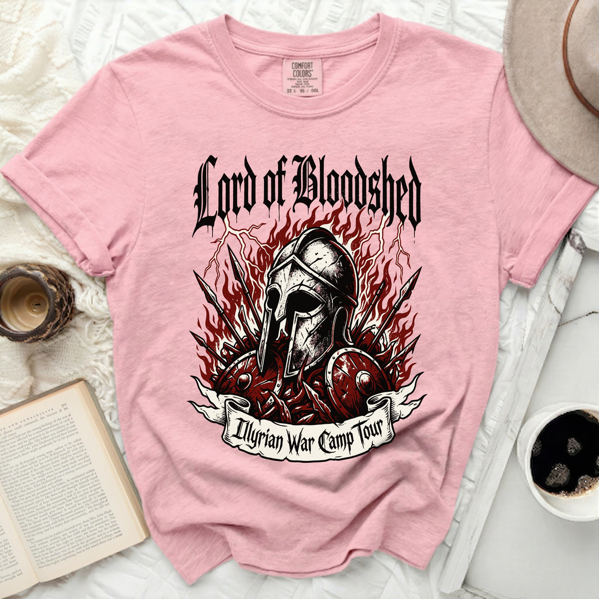 Pink t-shirt with "Lord of Bloodshed Illyrian War Camp Tour" graphic.