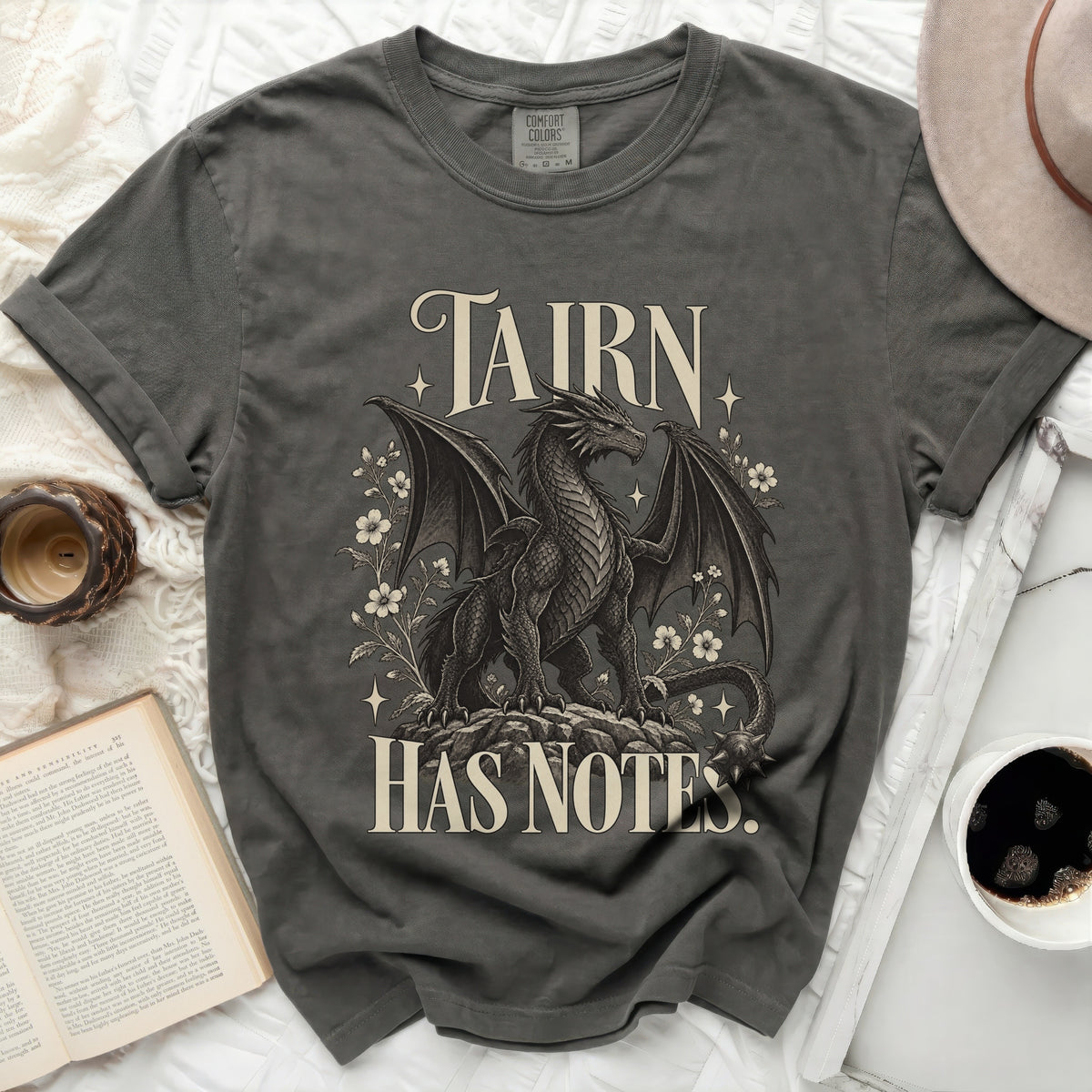 Grey t-shirt with a dragon and flowers graphic, reading "TAIRN HAS NOTES".