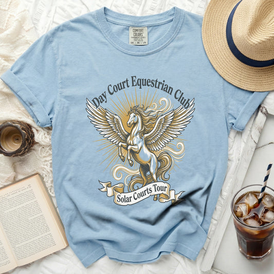 Light blue t-shirt with "Day Court Equestrian Club Solar Courts Tour" and a Pegasus graphic.
