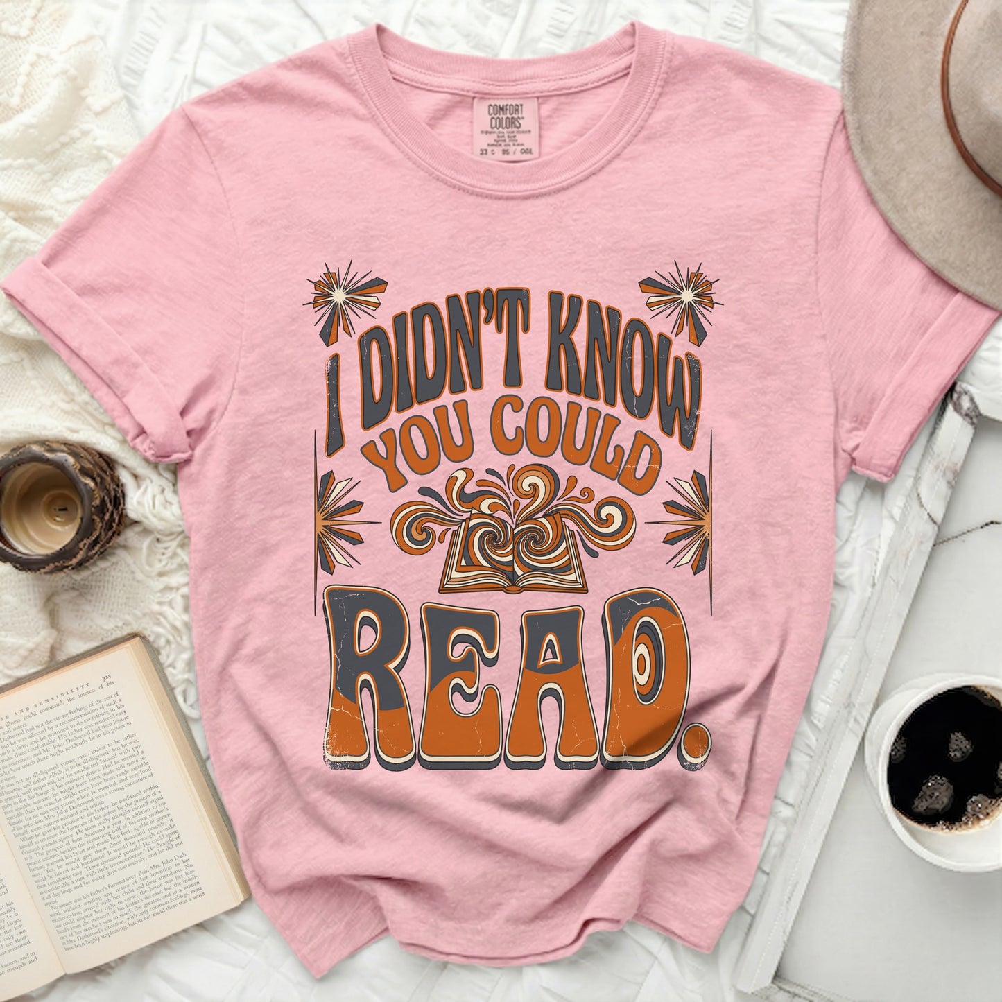 Pink t-shirt with "I didn't know you could read" in retro font.
