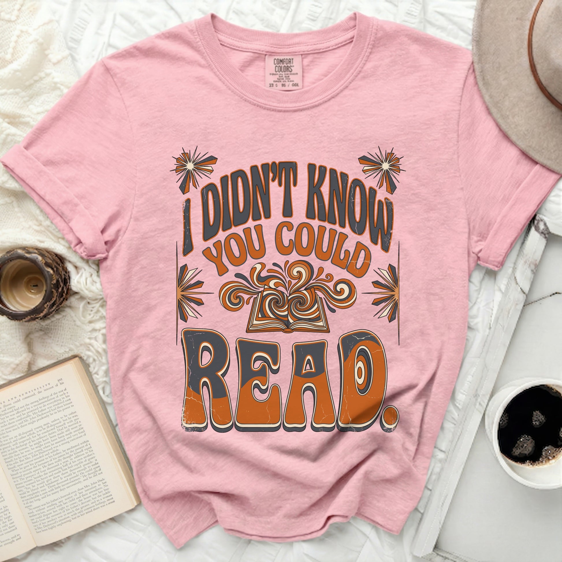 Pink t-shirt with "I didn't know you could read" in retro font.