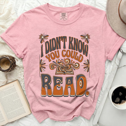 Pink t-shirt with "I didn't know you could read" in retro font.