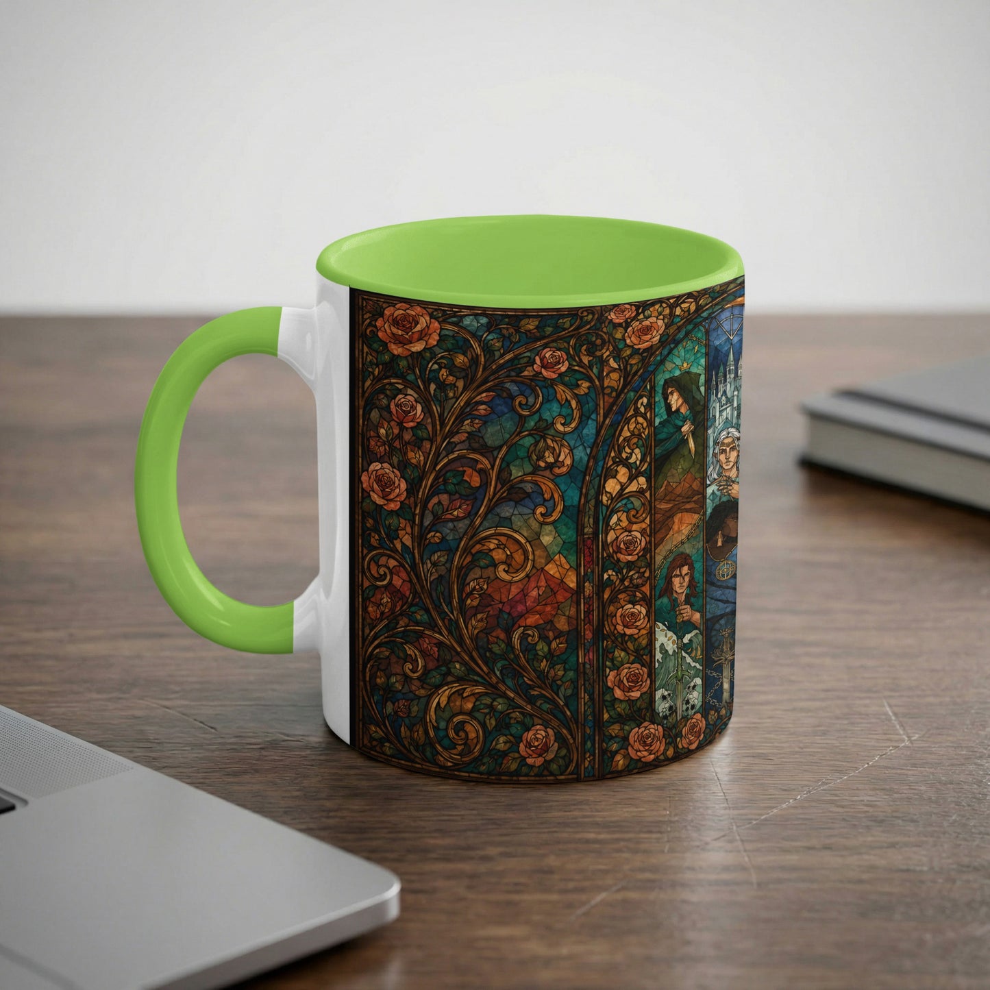 Mug with green handle featuring stained glass-style art of roses and figures.