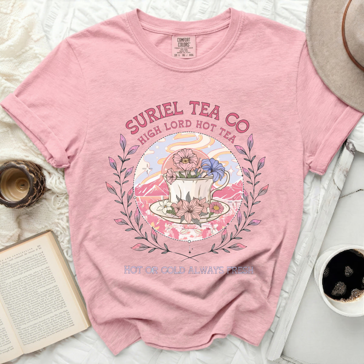 Pink Comfort Colors t-shirt with Suriel Tea Co. graphic and text.